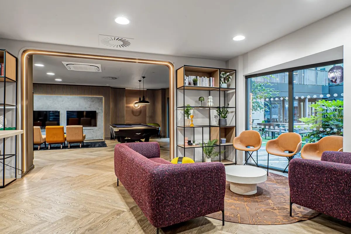 Modern lounge with pool table and seating living room at Chapter Old Street in London Student Accommodation