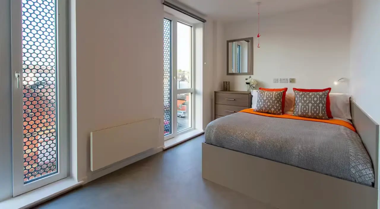 Bed dresser mirror and window bedroom at Dean Street Works in Bristol Student Accommodation