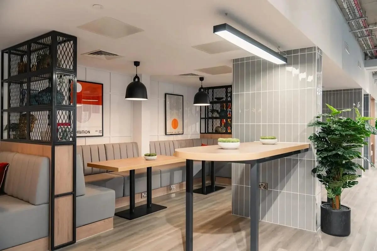 Booth seating tables and plant common area at Redgate in Nottingham Student Accommodation