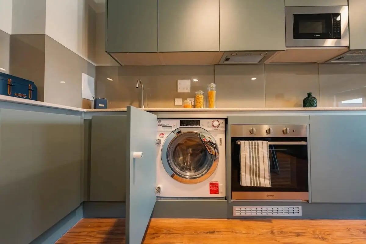 Washer oven microwave and cabinets kitchen at Redgate in Nottingham Student Accommodation