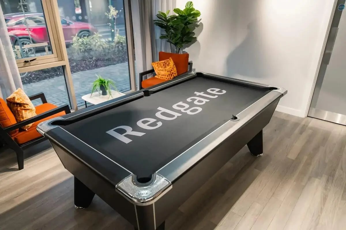 Pool table with Redgate logo living room at Redgate in Nottingham Student Accommodation