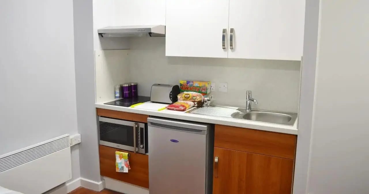 Compact kitchen with microwave fridge sink kitchen unit kitchen at Kaplan Living Nottingham in Nottingham Student Accommodation