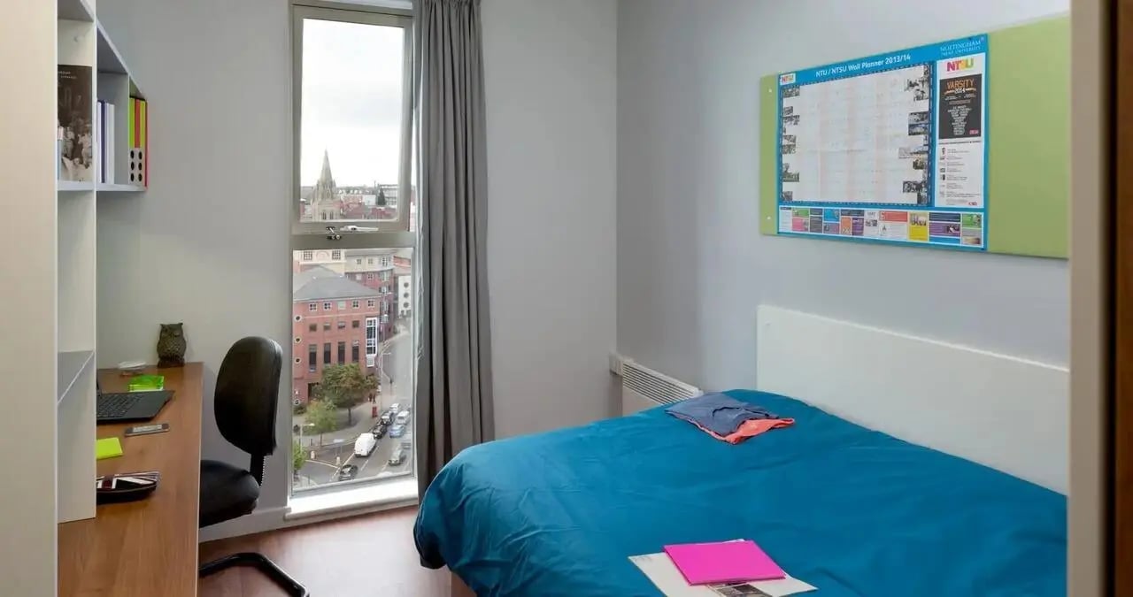 Desk chair laptop owl books bed study area bedroom at Kaplan Living Nottingham in Nottingham Student Accommodation