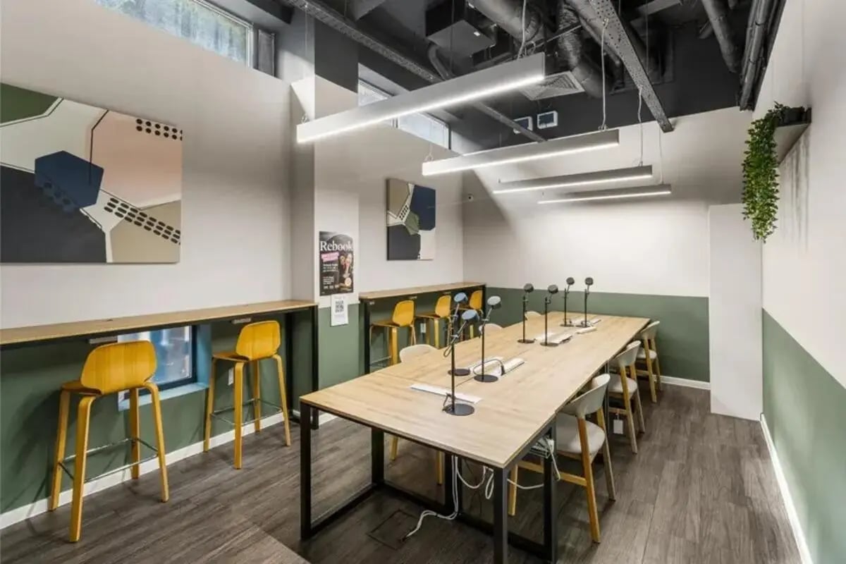 Long table with chairs and bar stools study area at Chapter Highbury in London Student Accommodation