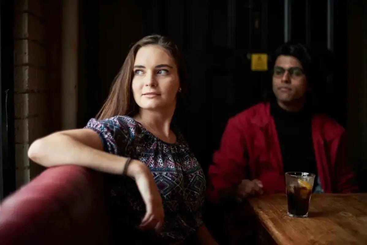 Young couple at table with drink living room at Chapter Highbury in London Student Accommodation