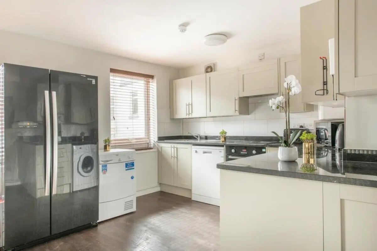 Fridge washing machine cabinets countertop appliances kitchen at 4 Rob Roy House in Nottingham Student Accommodation
