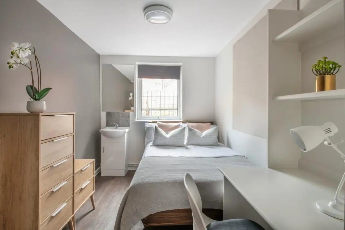 Bed dresser sink and desk bedroom interior at 4 Rob Roy House in Nottingham Student Accommodation
