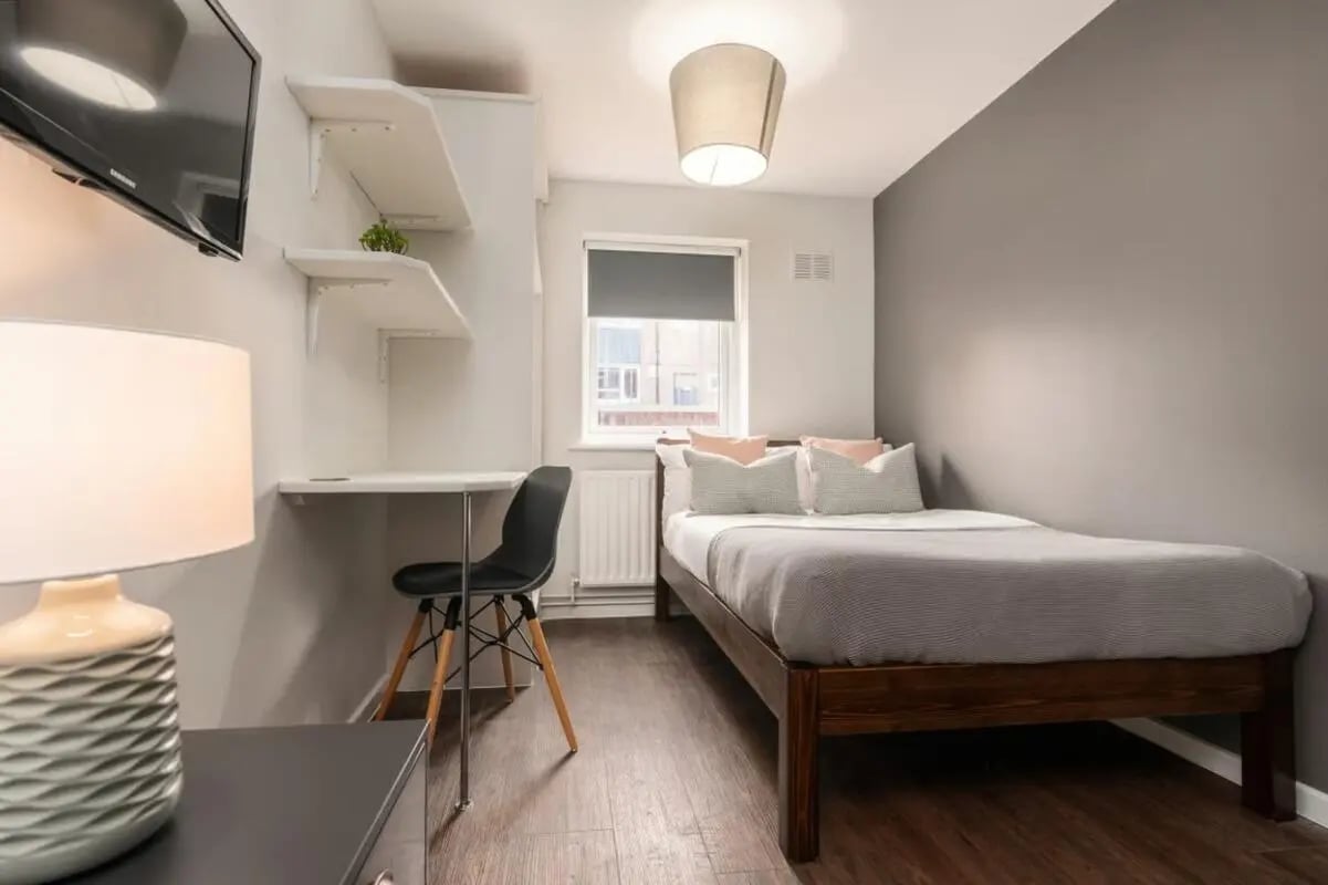 Bed desk shelves television lamp bedroom at 28 Church Street in Nottingham Student Accommodation