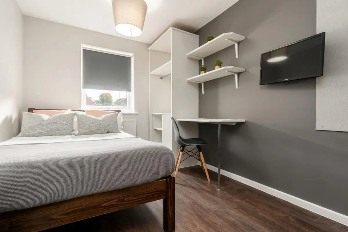 Bed desk shelves TV and wardrobe bedroom at 28 Church Street in Nottingham Student Accommodation