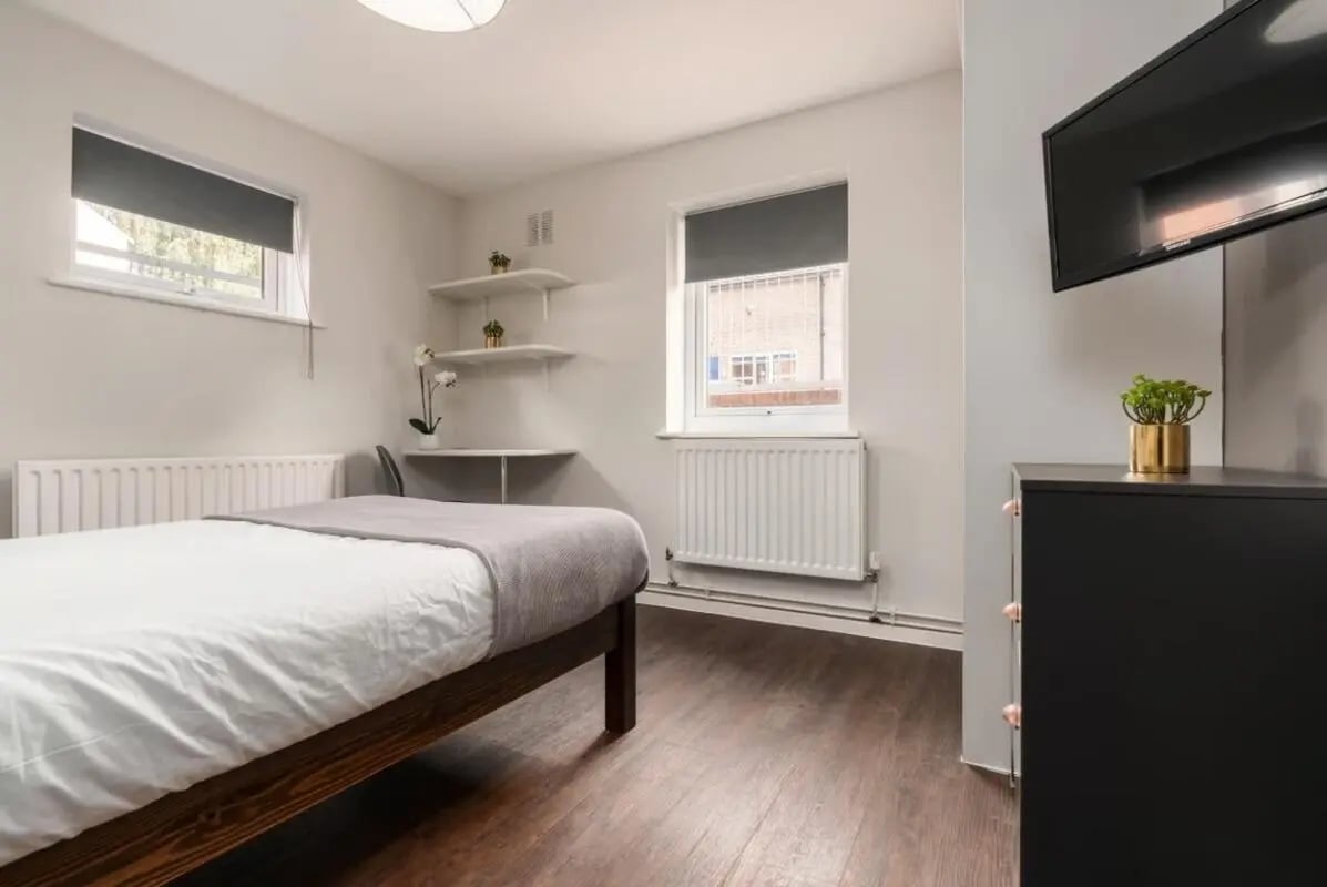 Bed, desk, shelves, TV, dresser bedroom at 28 Church Street in Nottingham Student Accommodation