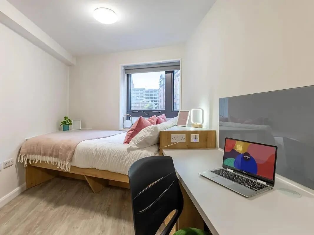 Bed desk chair laptop window lamp bedroom at Yugo Goldsmith Court in Nottingham Student Accommodation