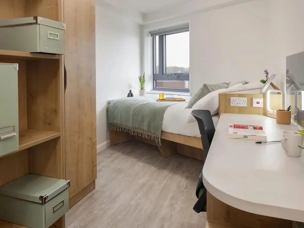 Bed desk wardrobe with storage boxes bedroom at Yugo Goldsmith Court in Nottingham Student Accommodation