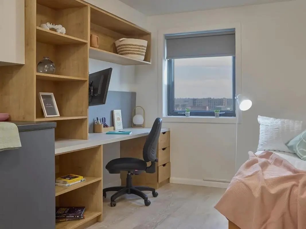 Desk chair shelves bed and window view bedroom at Yugo Goldsmith Court in Nottingham Student Accommodation