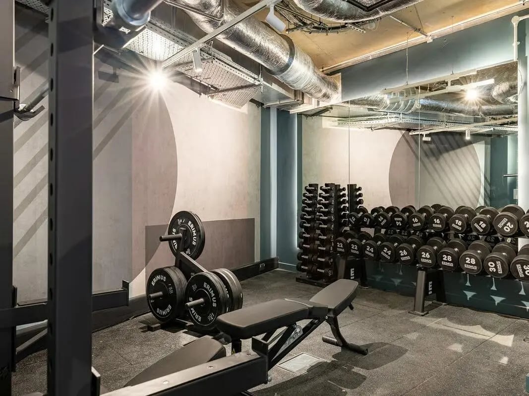 Dumbbells weight rack and bench Gym area at Fabric in Nottingham Student Accommodation