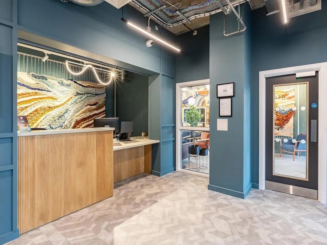 Reception desk computer tapestry artwork entrance at Fabric in Nottingham Student Accommodation