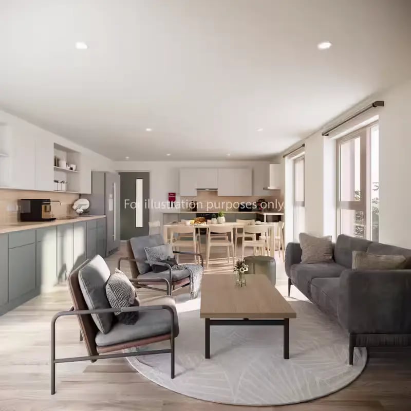 Sofa chairs coffee table kitchen living area at City Wharf in Glasgow Student Accommodation