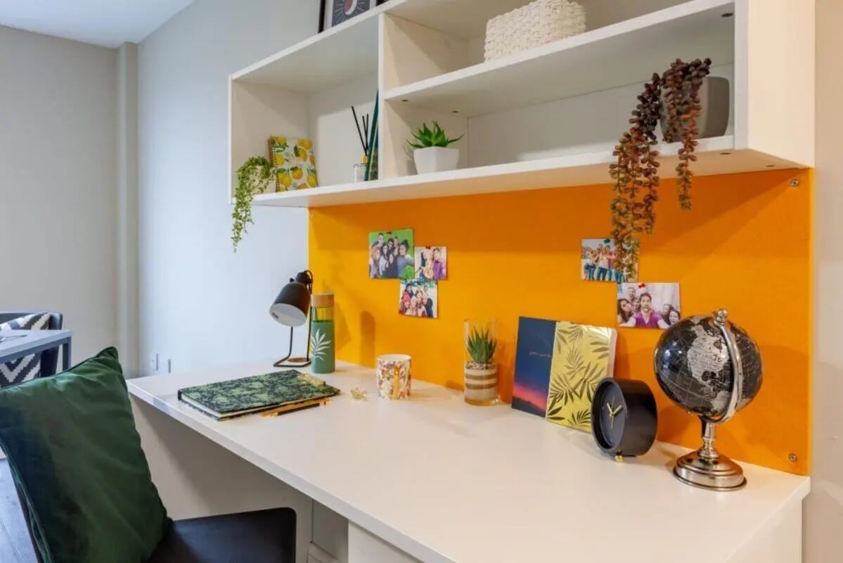 Desk with lamp photos globe and globe study area at One Islington Plaza in Liverpool Student Accommodation