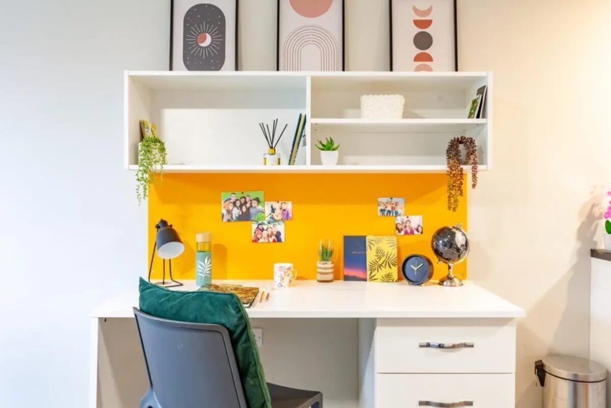Desk with chair photos and globe study area at One Islington Plaza in Liverpool Student Accommodation