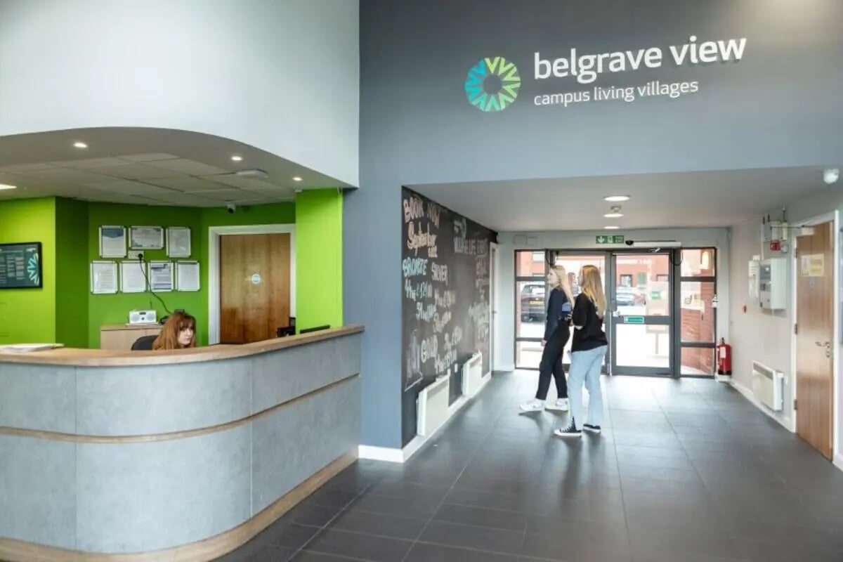 Reception desk and students in lobby lobby at Belgrave View in Birmingham Student Accommodation