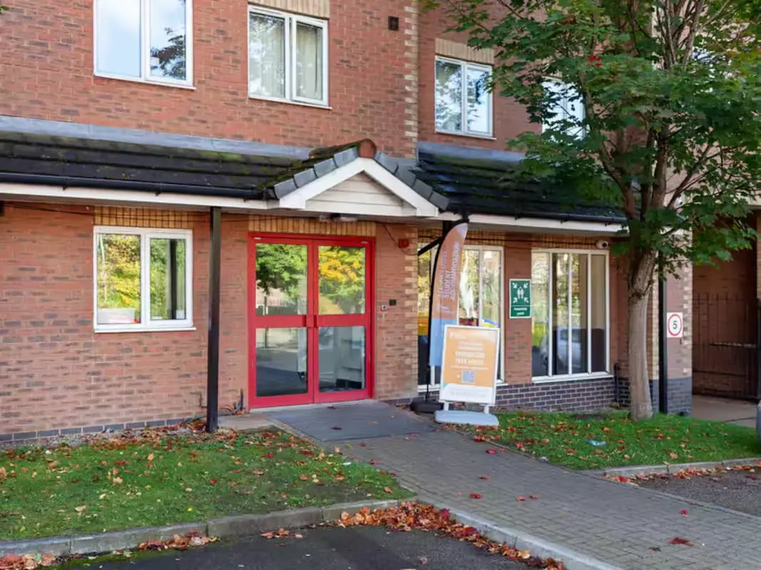 Red double doors entrance windows and signage exterior at Paddington Park House in Liverpool Student Accommodation