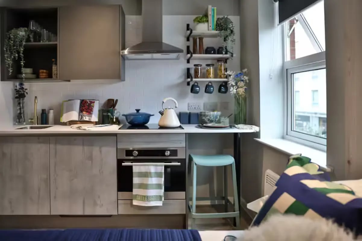 Modern kitchen with oven and stool kitchen at Brook Studios in Birmingham Student Accommodation