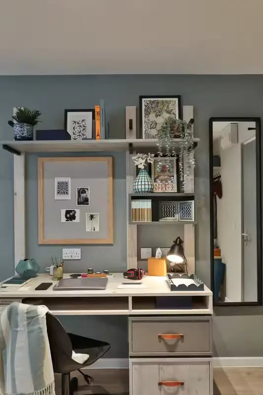 Desk with chair photos and lamp study area at Brook Studios in Birmingham Student Accommodation