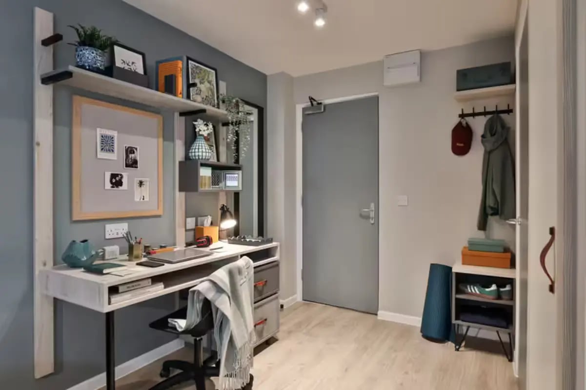 Desk shelves chair coat hooks storage unit study area at Brook Studios in Birmingham Student Accommodation