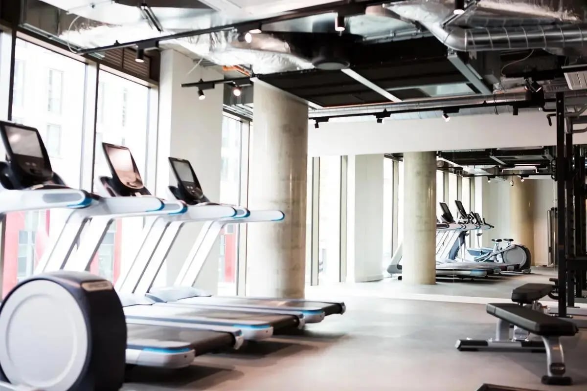 Row of treadmills and exercise equipment gym at Chapter Highbury II in London Student Accommodation