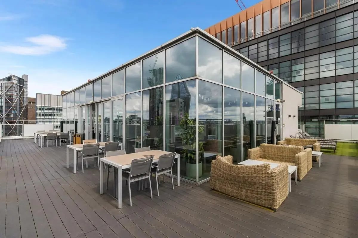 Tables chairs sofas on outdoor terrace terrace area at Chapter South Bank in London Student Accommodation