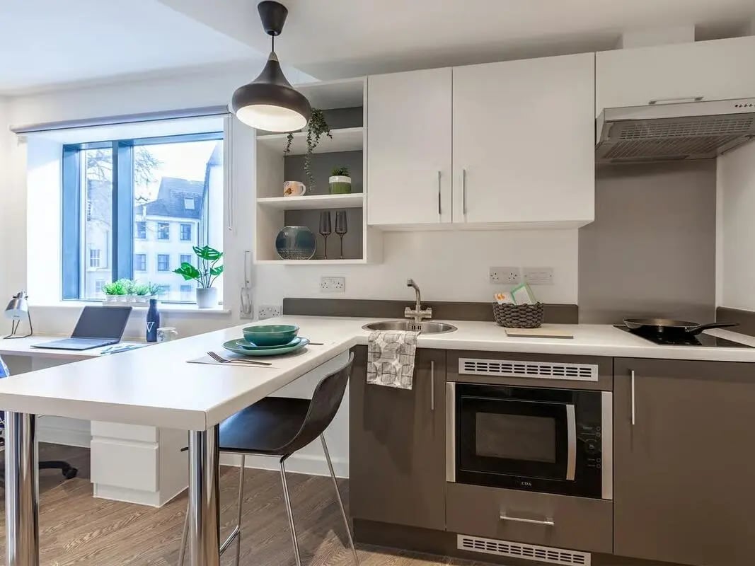 Kitchenette with desk and laptop kitchen area at Saltwater Place in Plymouth Student Accommodation