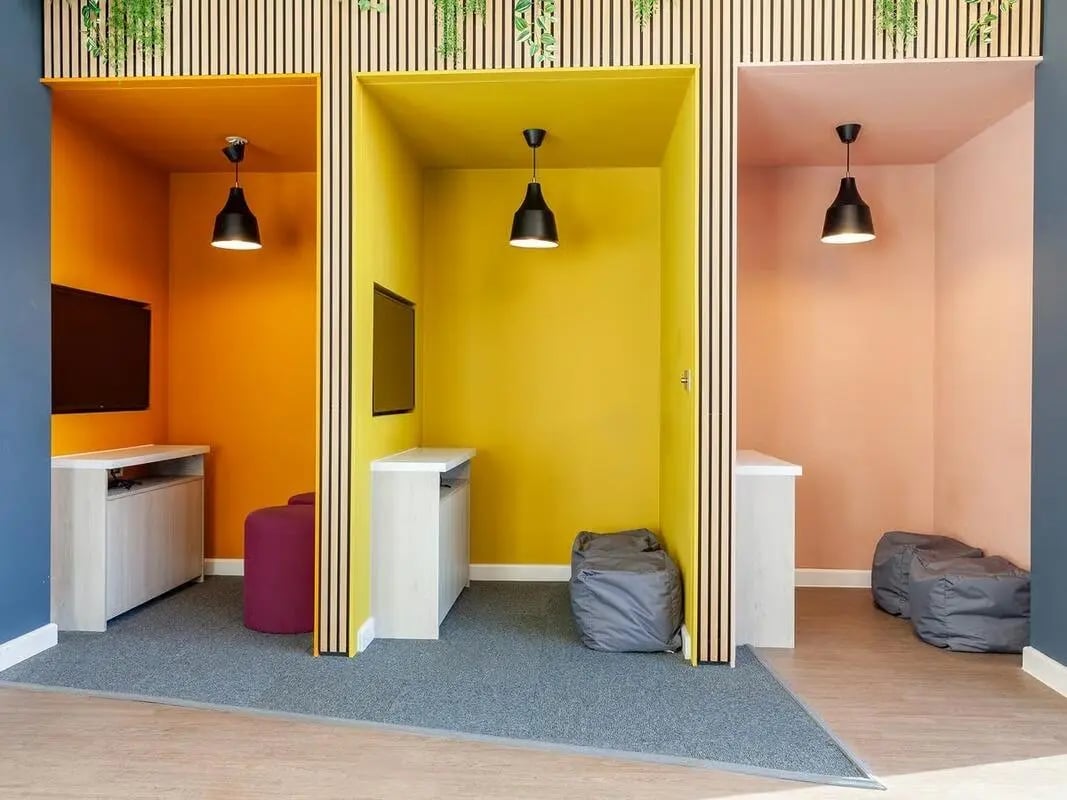 Colorful pods with TVs beanbags and desks lounge at Saltwater Place in Plymouth Student Accommodation