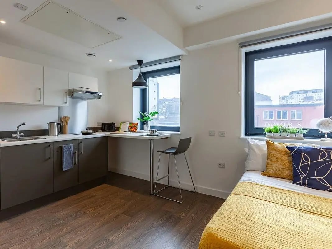 Modern studio kitchen with bed and desk study area at Saltwater Place in Plymouth Student Accommodation
