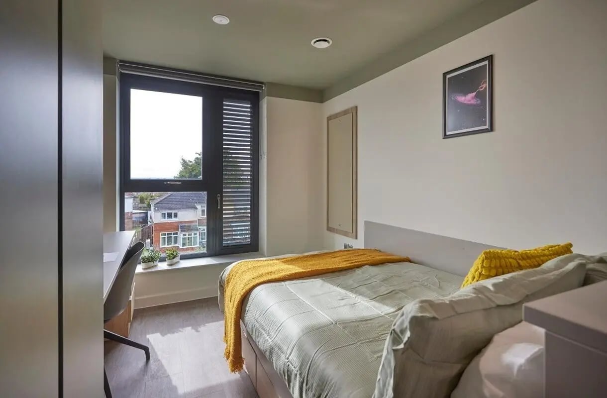 Bed desk window and artwork bedroom at Regatta Place in Durham Student Accommodation