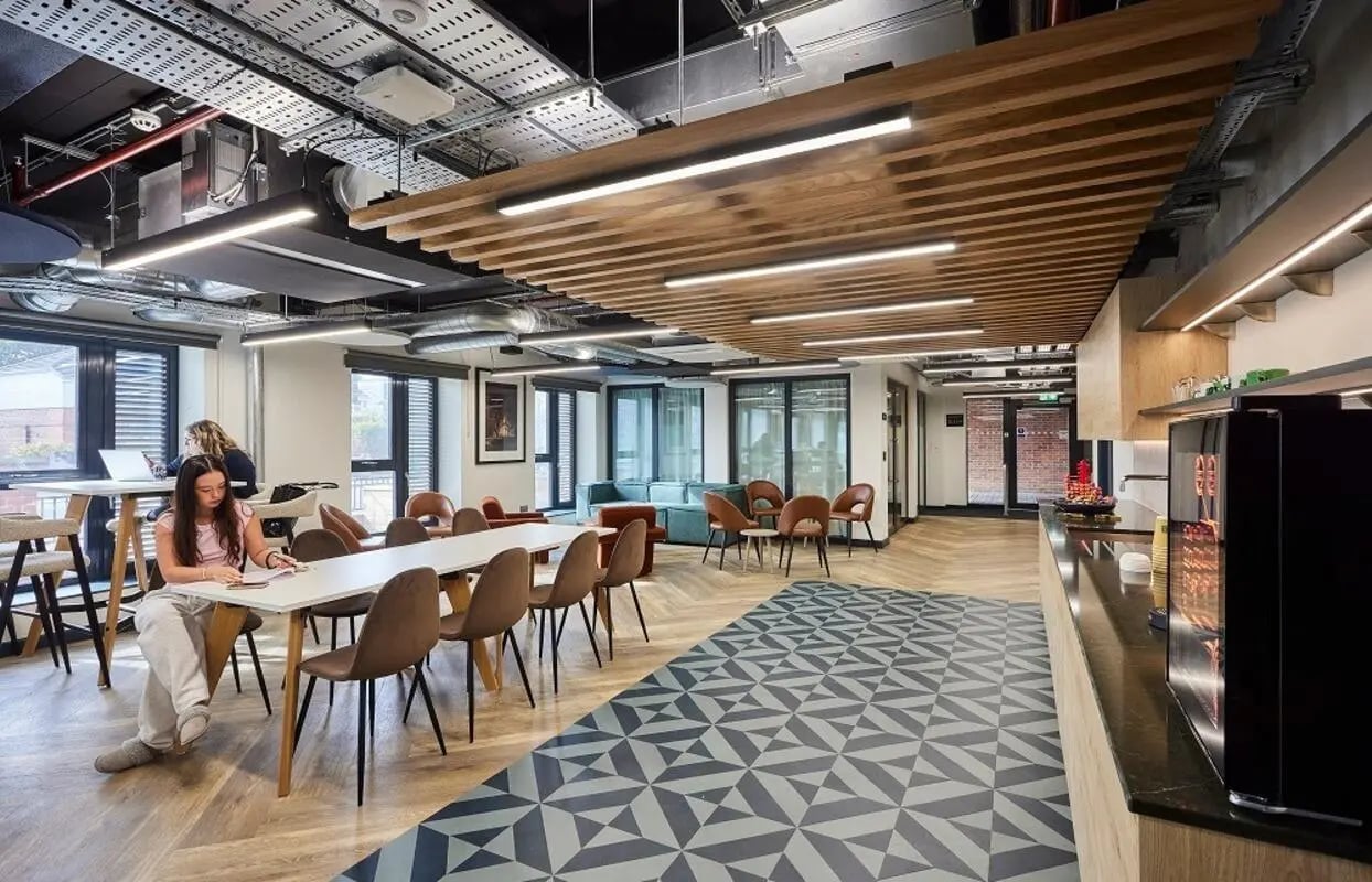Dining area with chairs study tables coffee machine communal area at Regatta Place in Durham Student Accommodation