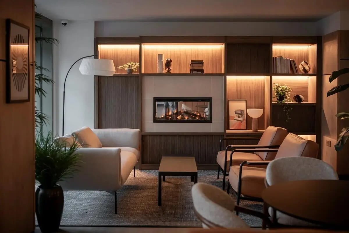 Modern lounge with fireplace and seating living room at Centre Court in Nottingham Student Accommodation
