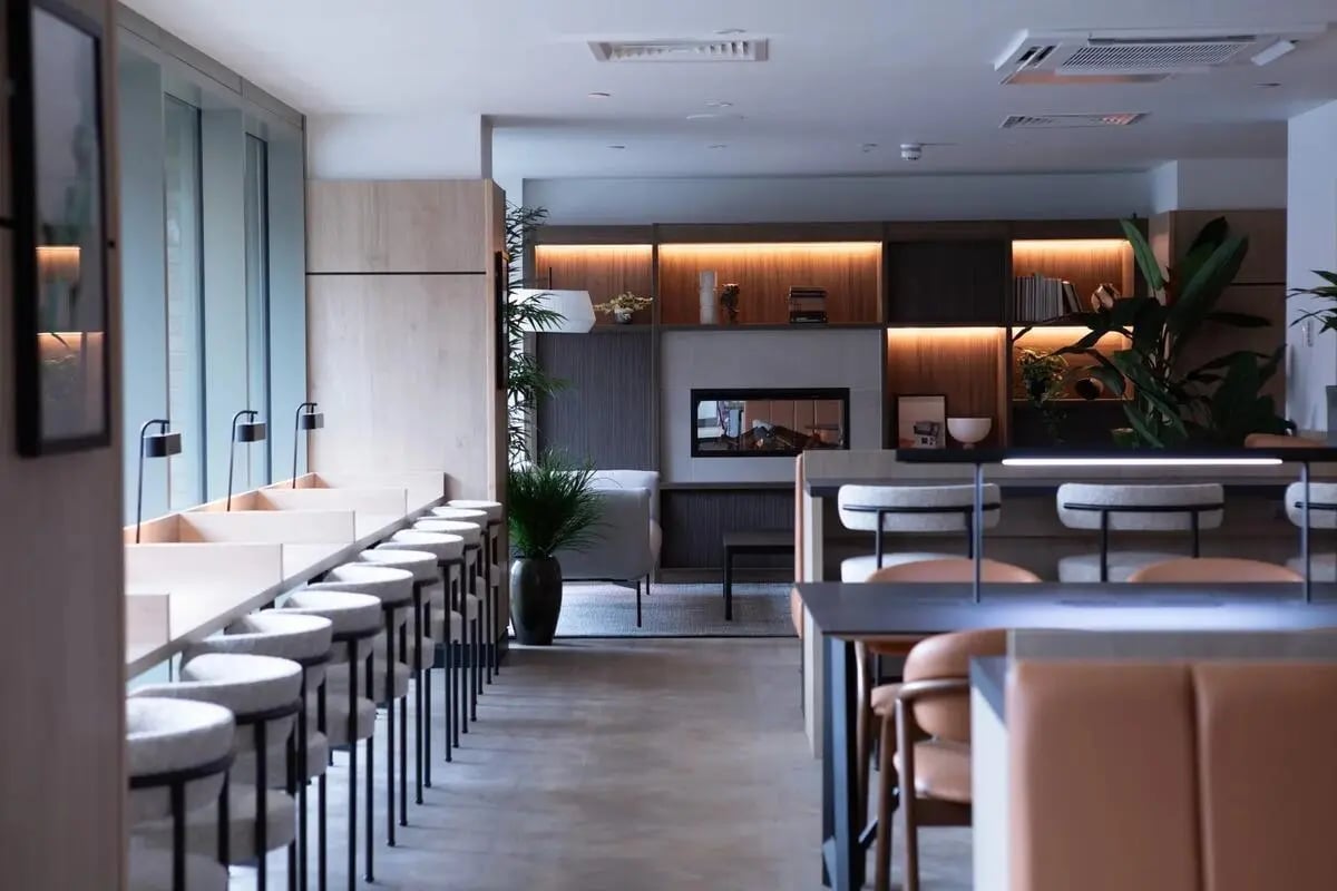 Modern communal area with seating and fireplace lounge at Centre Court in Nottingham Student Accommodation