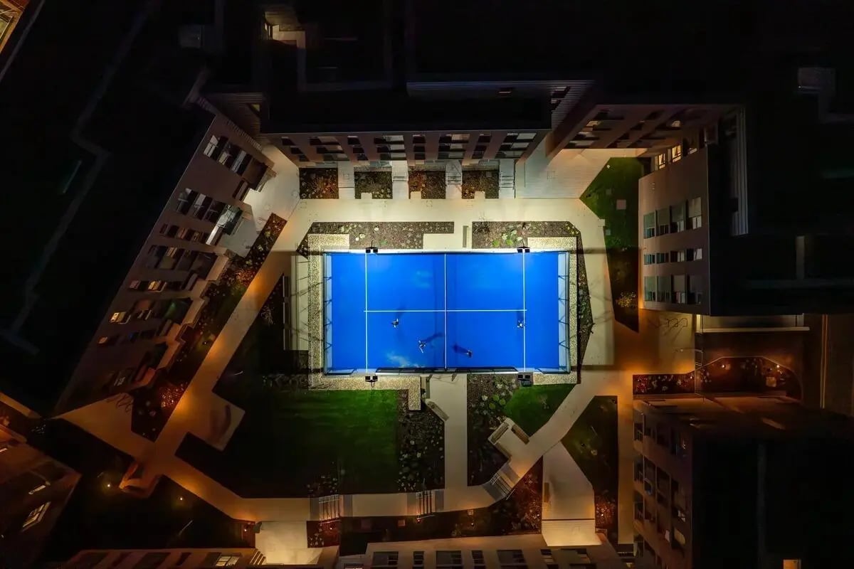 Aerial view of illuminated court with people playing playing area exterior at Centre Court in Nottingham Student Accommodation