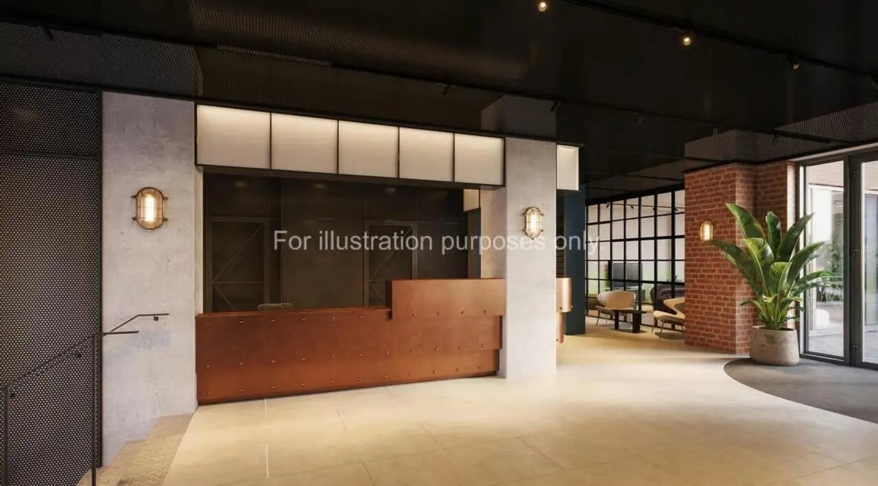 Reception desk plant and seating area lobby at Ark Canning Town in London Student Accommodation