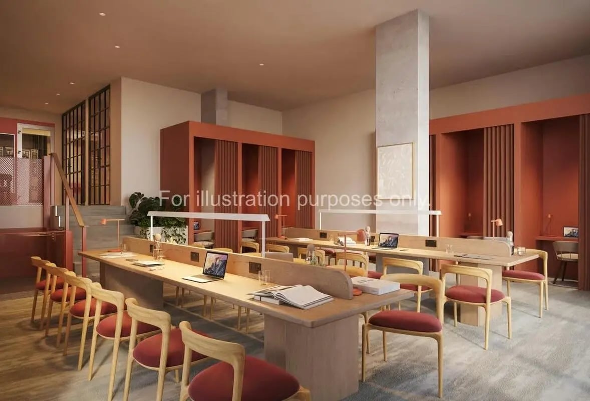 Study desks with laptops and chairs study area at Ark Canning Town in London Student Accommodation