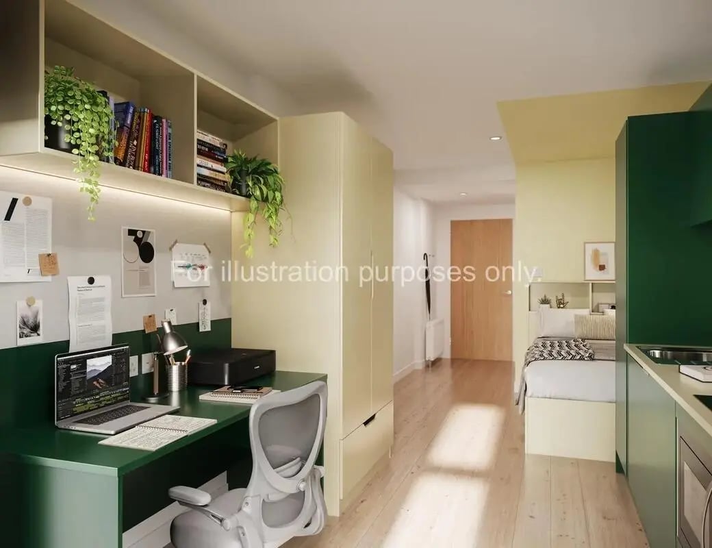 Desk laptop printer chair bed kitchen living area bedroom at St Vincent Studios in Glasgow Student Accommodation