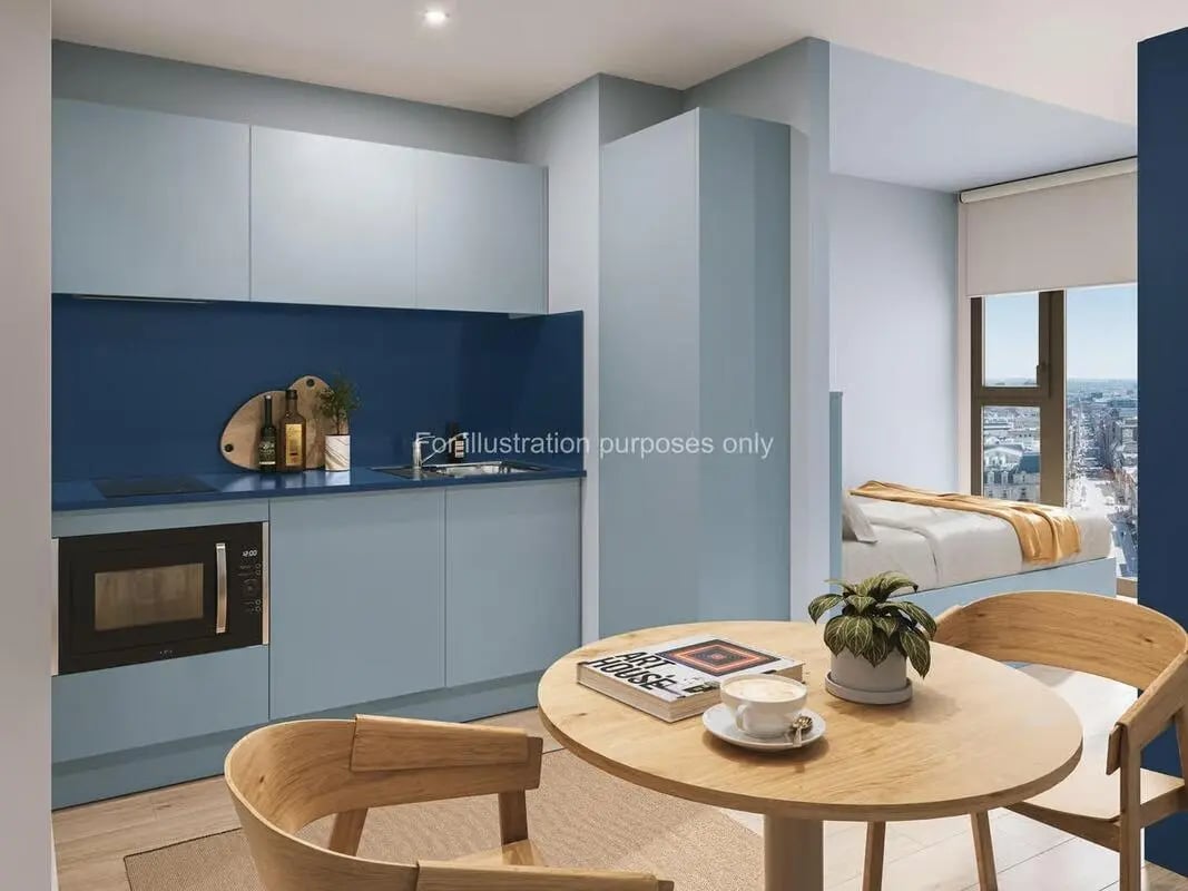 Kitchen counters microwave bed and dining table studio apartment at St Vincent Studios in Glasgow Student Accommodation