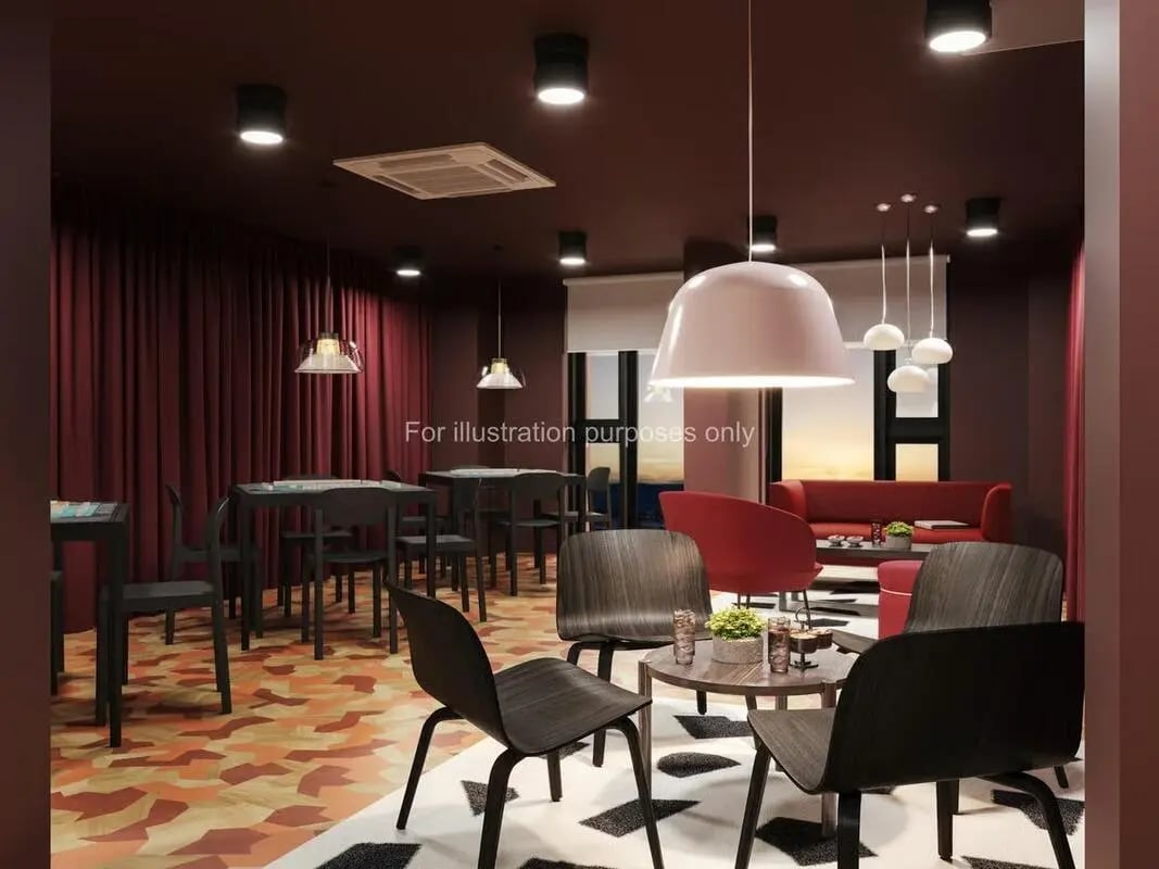 Dining tables chairs lounge sofas coffee table common area at St Vincent Studios in Glasgow Student Accommodation