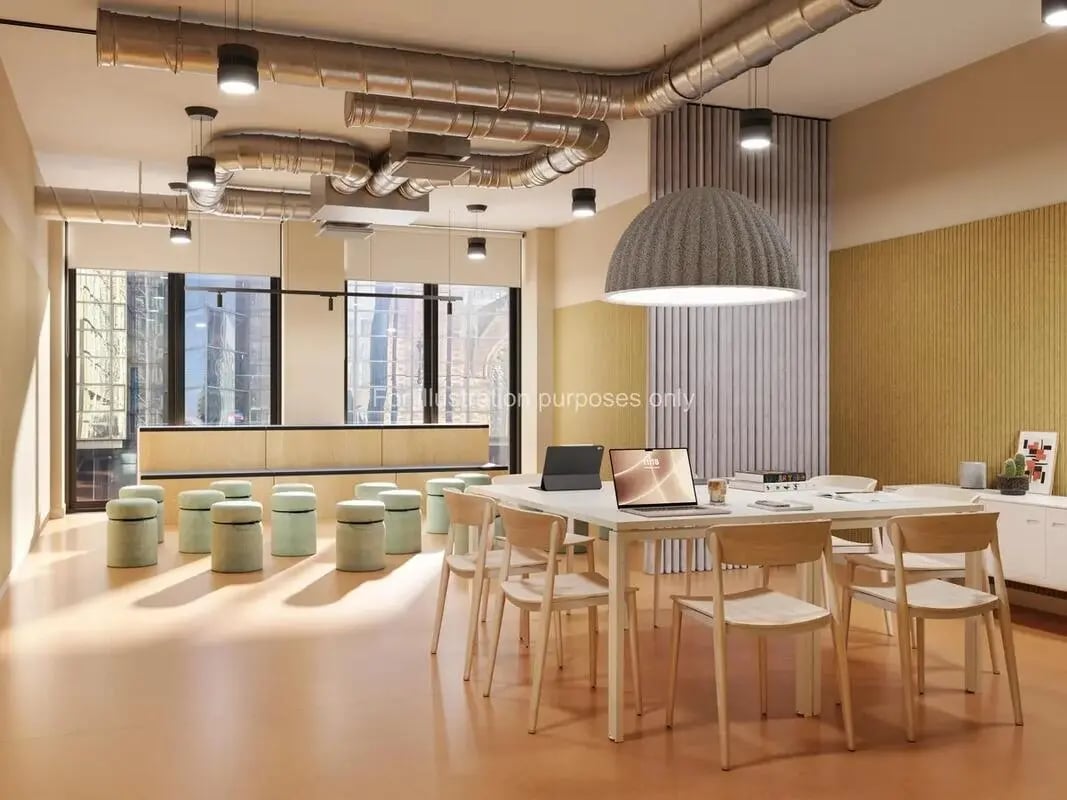 Round stools and study table with laptops communal area at St Vincent Studios in Glasgow Student Accommodation