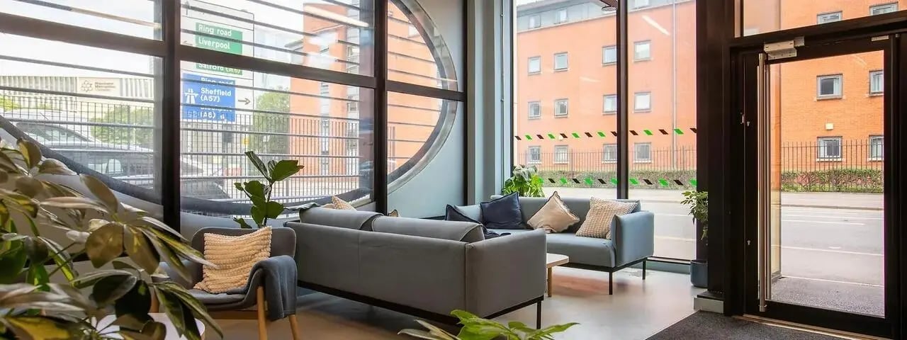 Sofa plant and chairs lounge area at Element Manchester in Manchester Student Accommodation