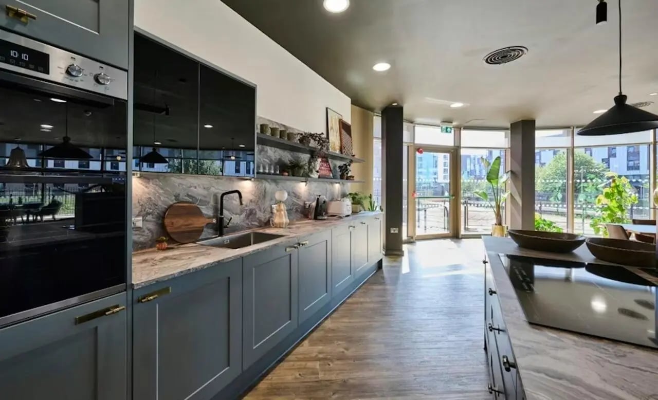Modern gray cabinets sink and oven kitchen at Deakins Place in Nottingham Student Accommodation