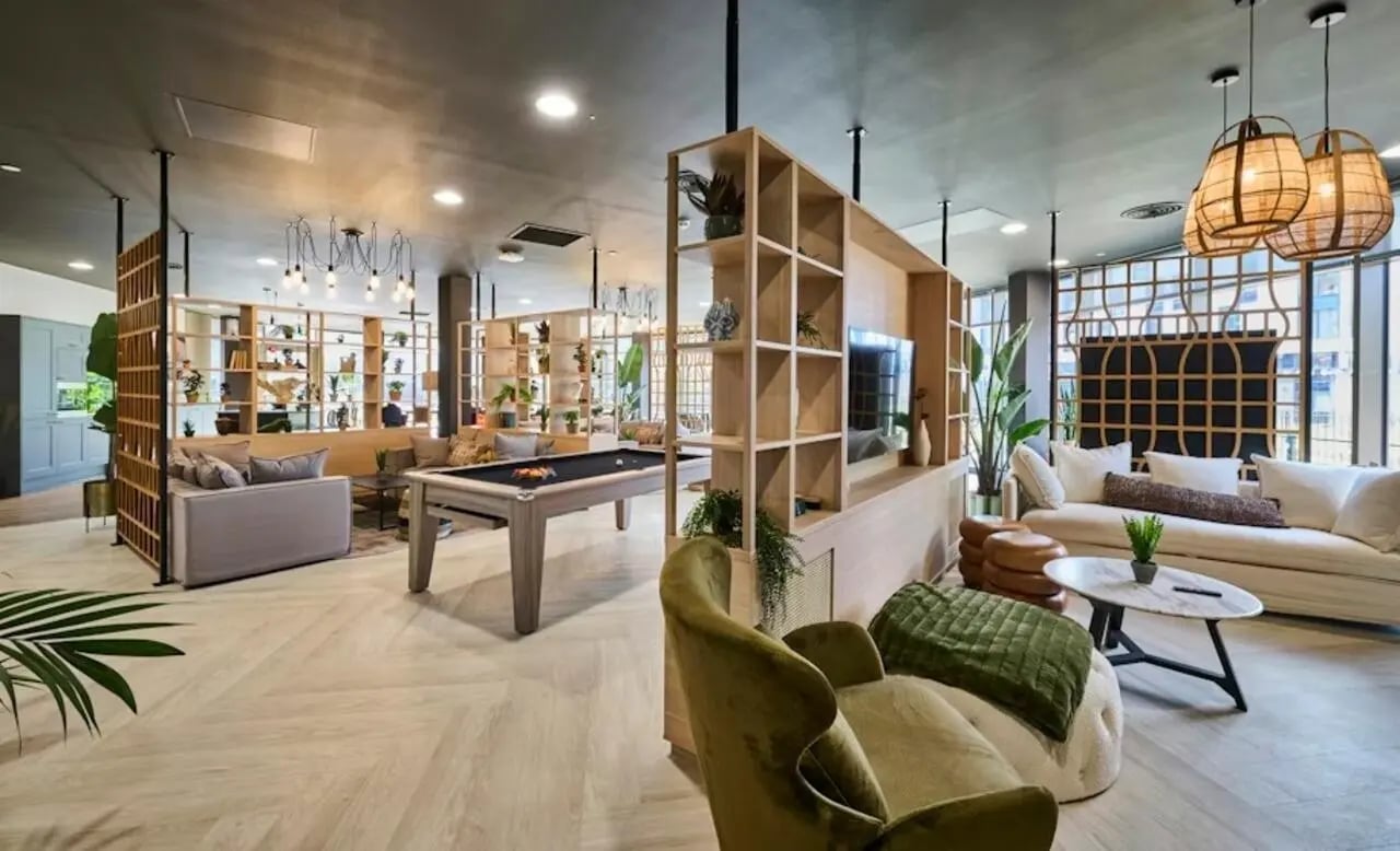 Pool table sofas and shelving living room at Deakins Place in Nottingham Student Accommodation