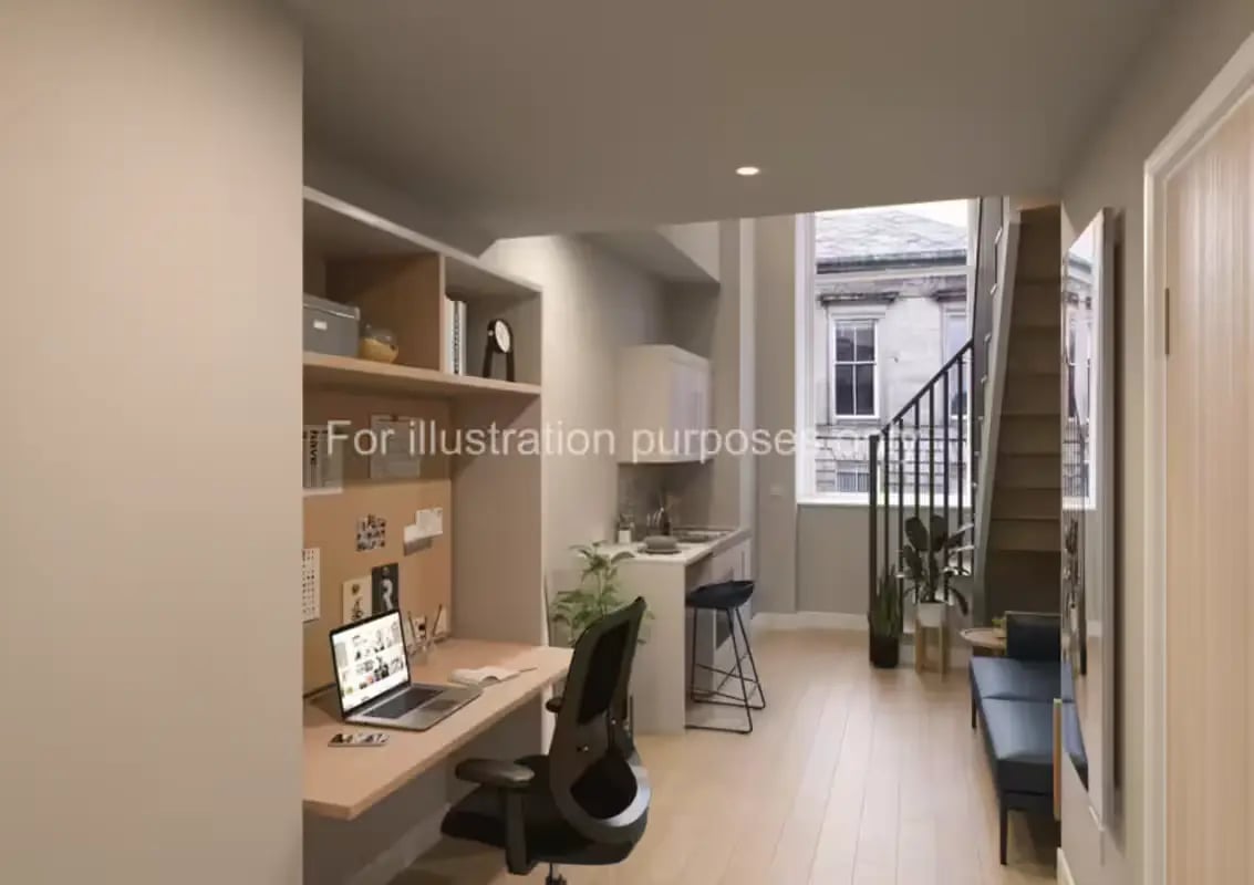Desk chair laptop shelves kitchen stairs seating area living room at Glasgow Citi View  in Glasgow Student Accommodation