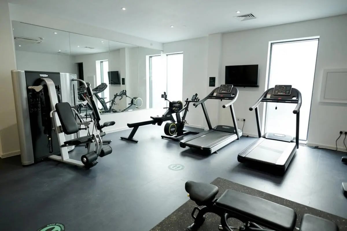 Gym with treadmills rowing machine and weights fitness area at Canvas Walthamstow in London Student Accommodation