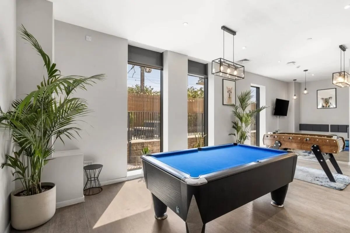 Pool table and foosball table common area at Canvas Walthamstow in London Student Accommodation