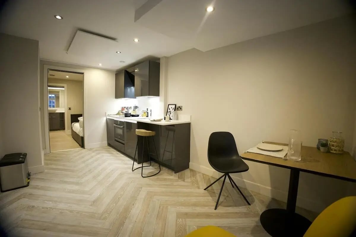 Modern studio apartment kitchen dining and bedroom living room at dwell 121 Princess Street in Manchester Student Accommodation